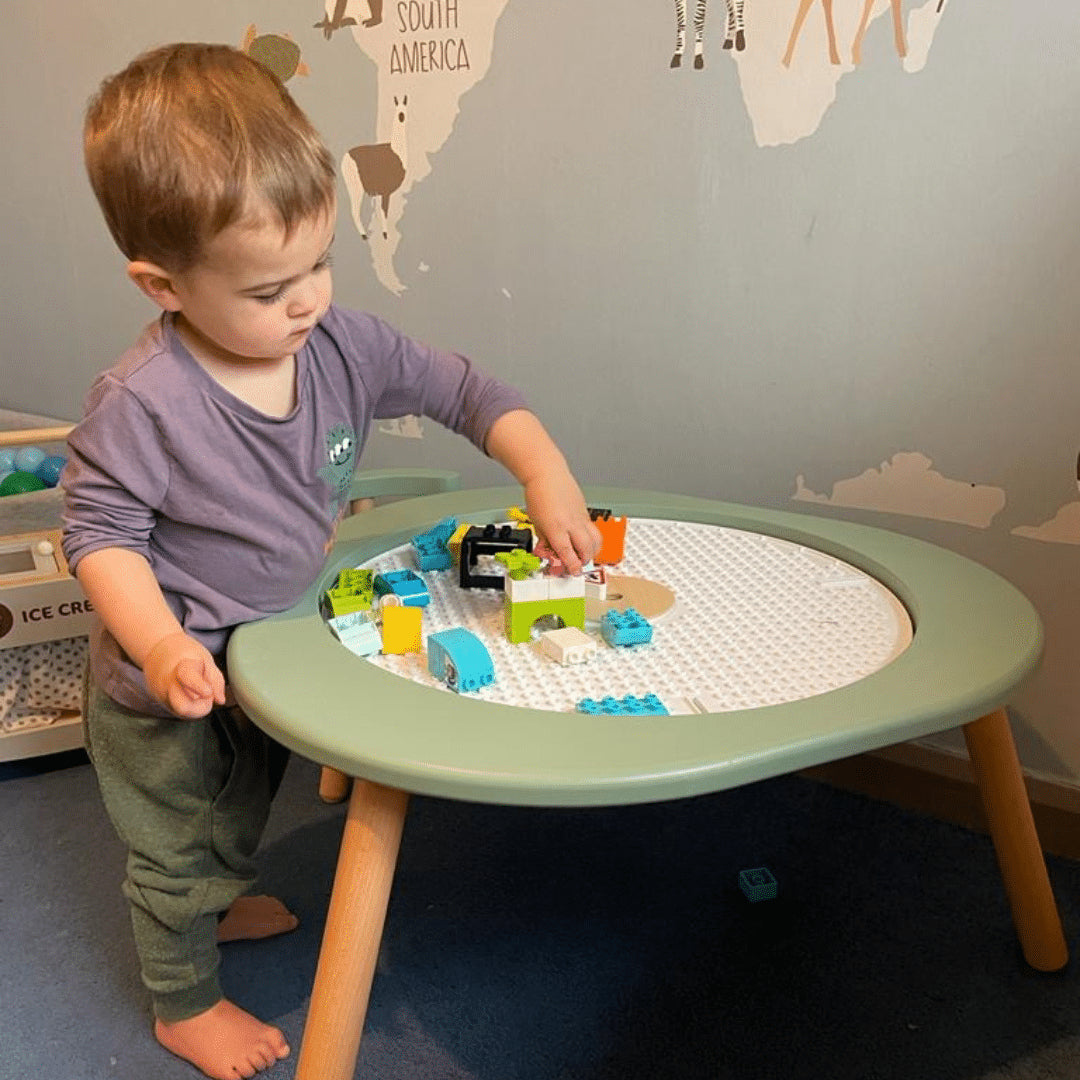 Stokke MuTable V2 study and play table, made from natural wood, with safe anti-slip base