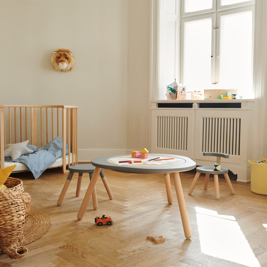 Stokke MuTable V2 study and play table, made from natural wood, with safe anti-slip base